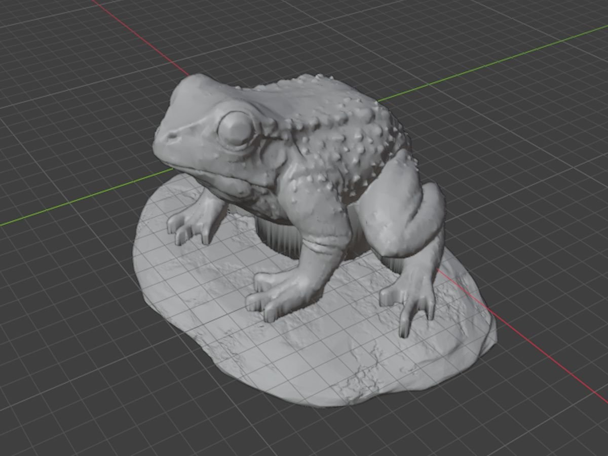 A statue being sculpted as a 3D model on screen